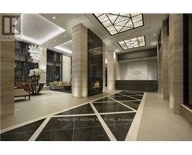 A spacious lobby with a black and white checkered floor.