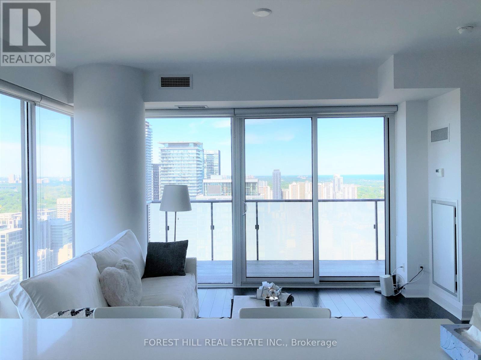 A living room with a view of the city.