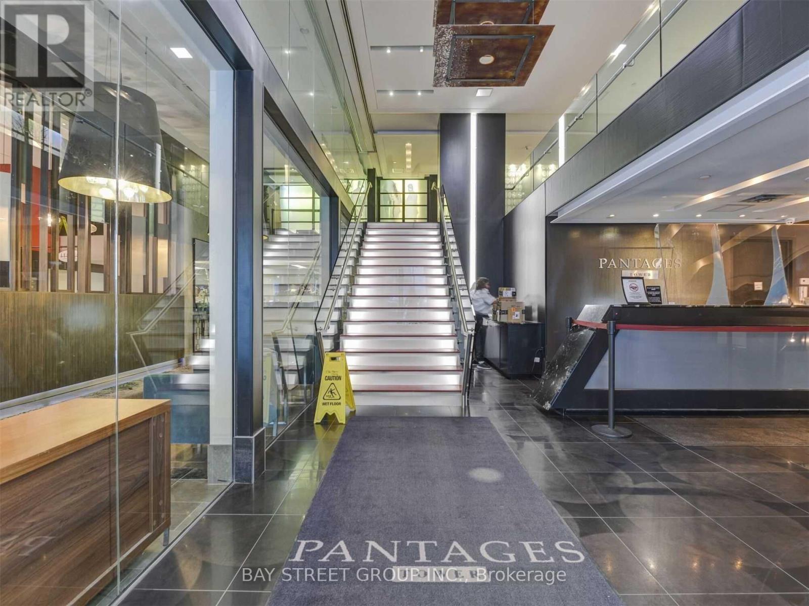 A hallway with a Pantagies sign on the floor.