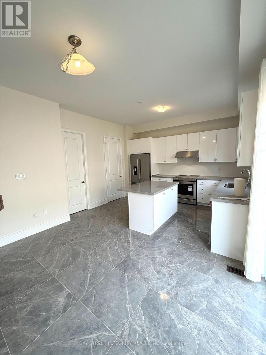 A kitchen with a marble floor and white walls.