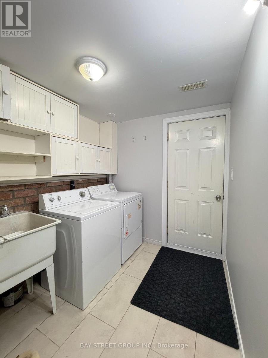 A laundry room with a washer and dryer.