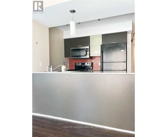 A kitchen with a stove top oven and microwave.