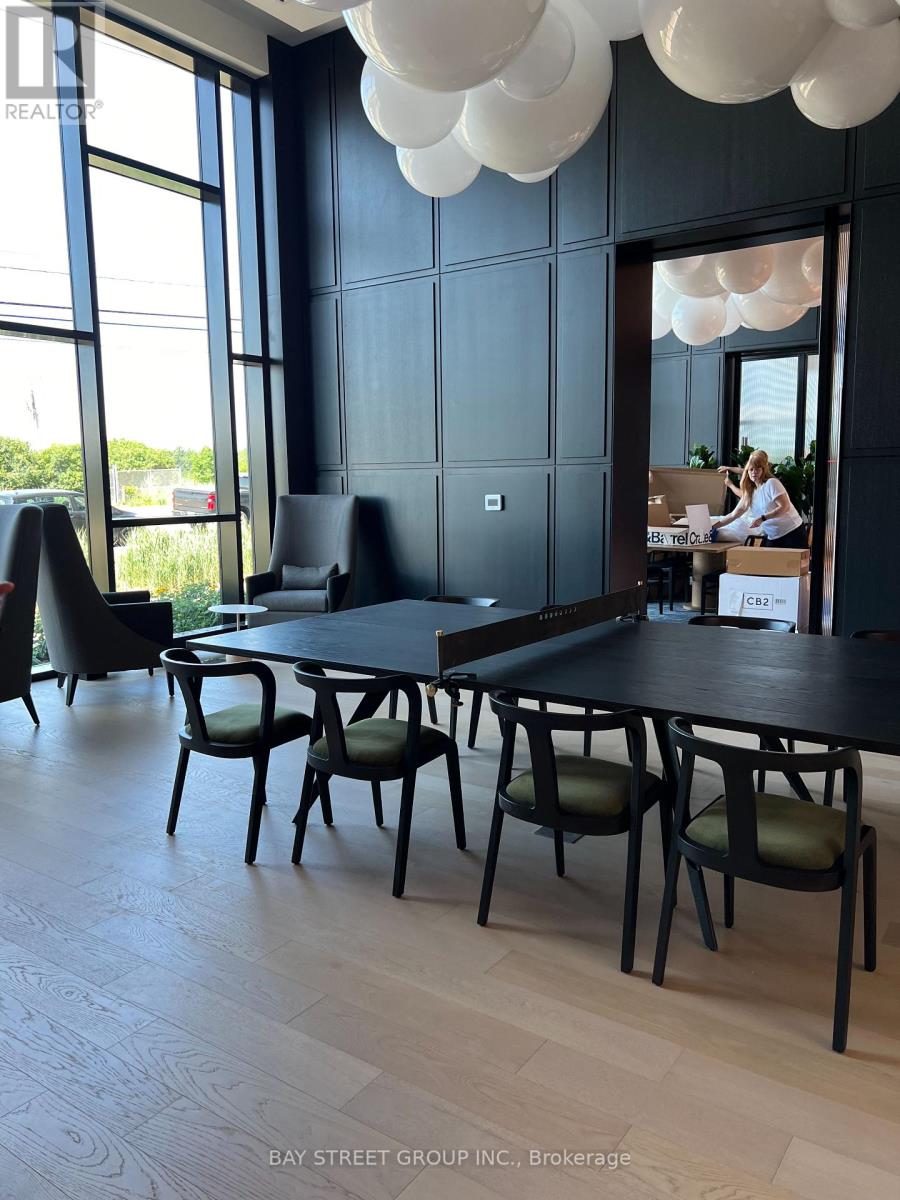 A conference room with a long table and chairs.