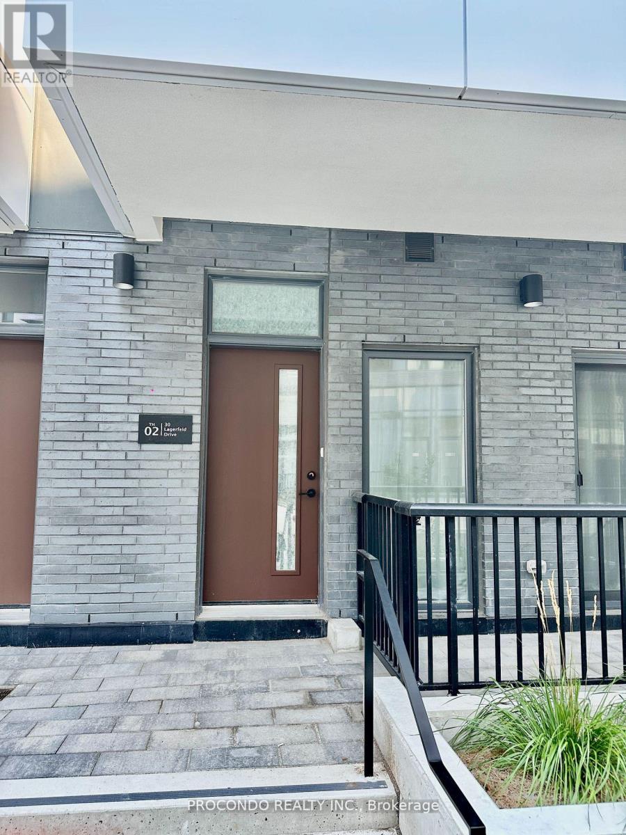 A modern house with a brown door and windows.
