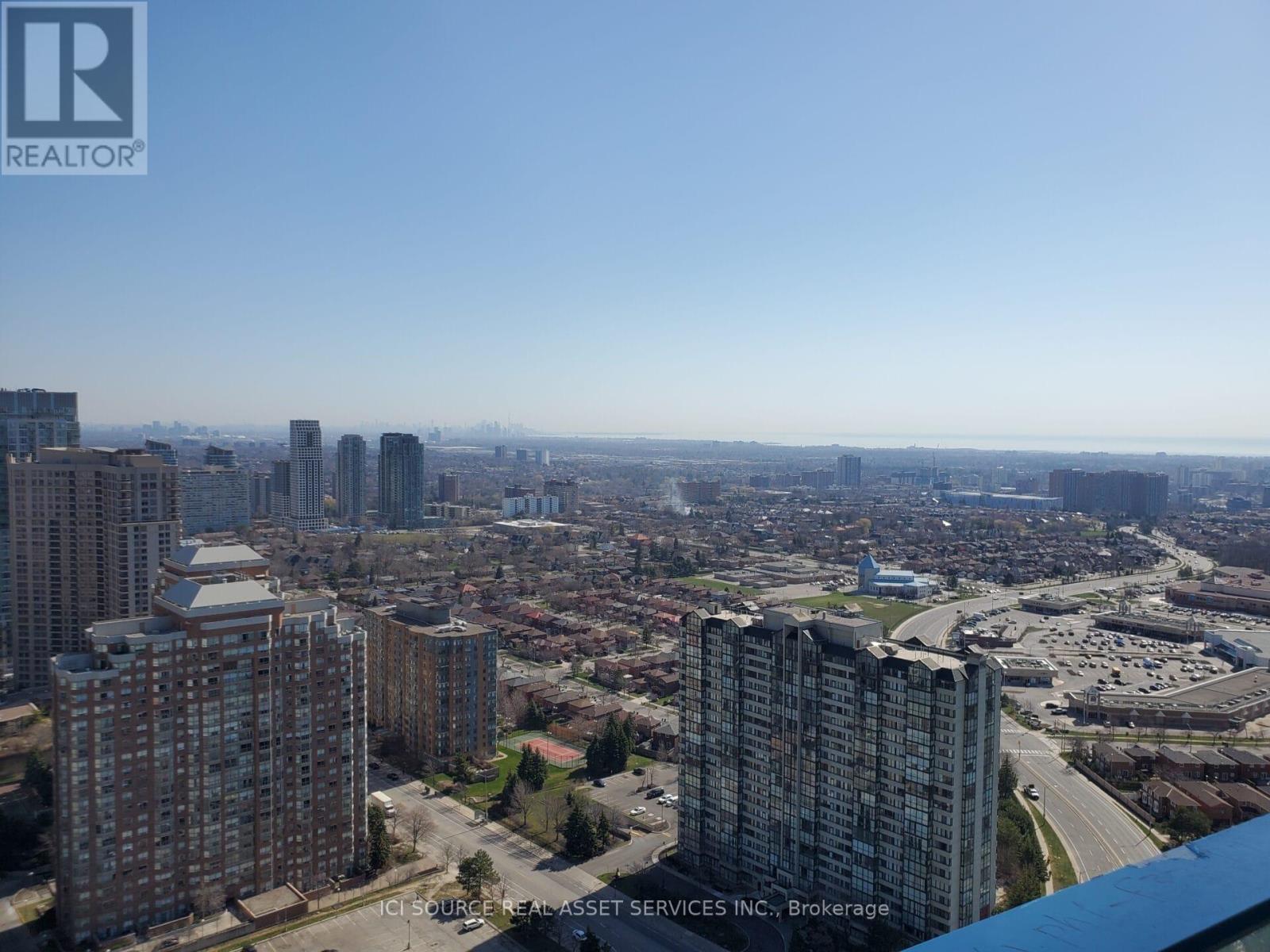 A cityscape with tall buildings and a clear sky.