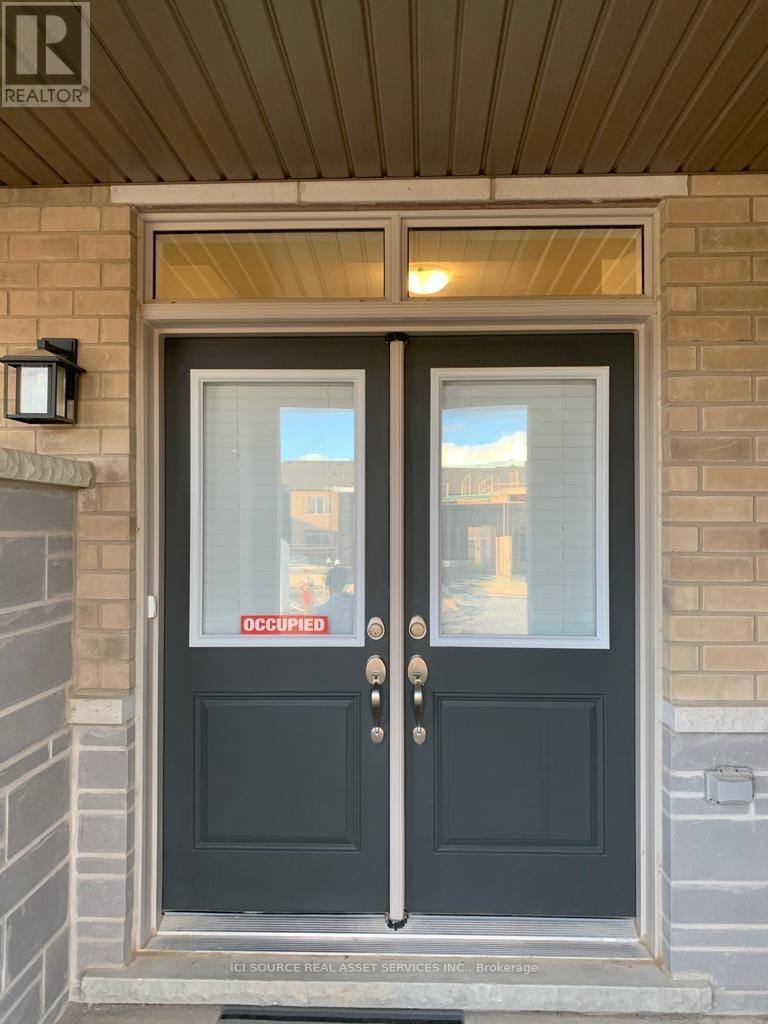 A door with a glass window and a sign that says "Occupied" is closed.