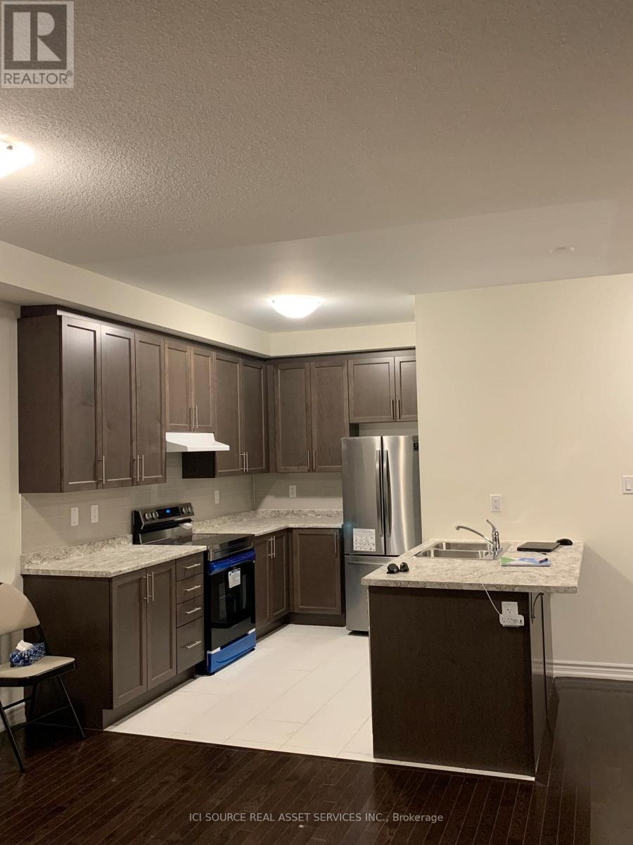 A kitchen with brown cabinets and a white countertop.