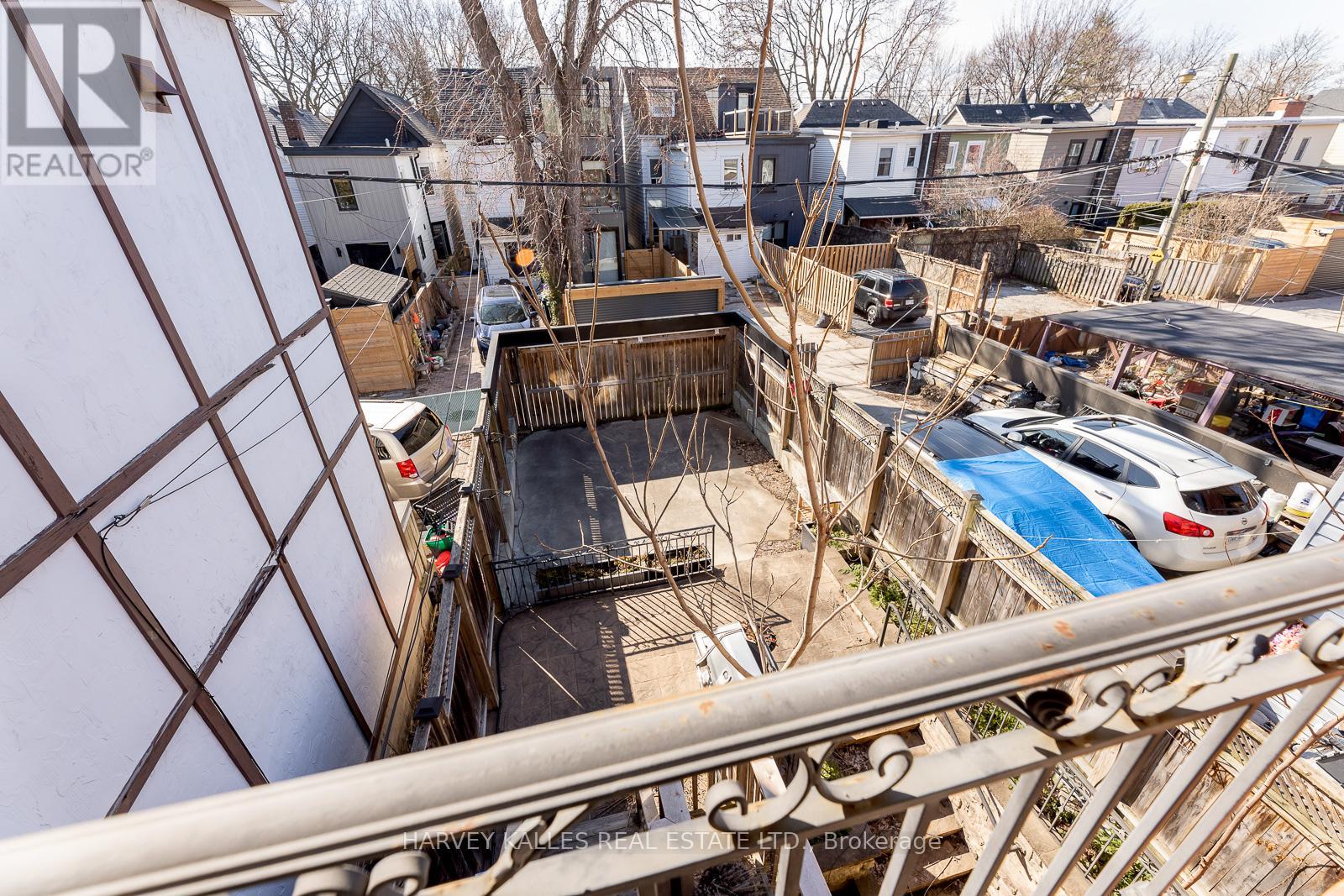 A view from a balcony looking down at a pool and a construction site.