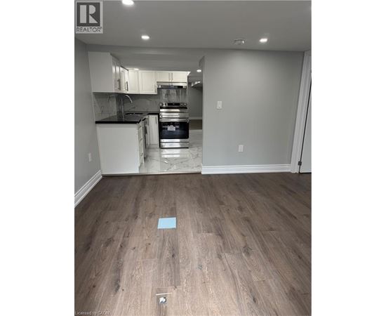 A kitchen with a white oven and a white fridge.