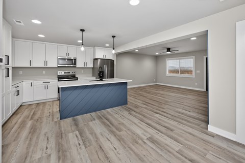 A modern kitchen with a large island in the middle.