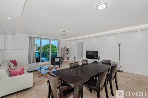 A modern dining room with a large table and chairs.