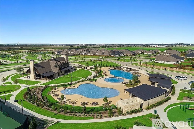 A large, well-maintained community with a swimming pool and a variety of houses.