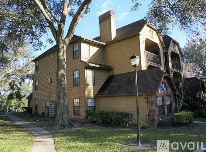 A house with a tree in front of it.