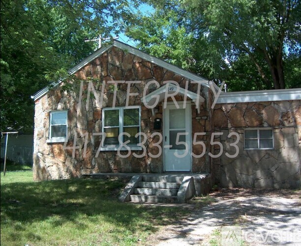 A stone building with the word INTEGRITY written on it.