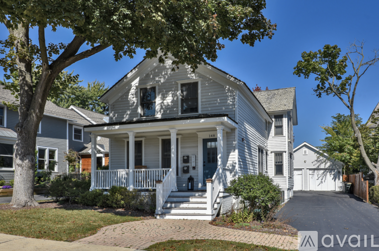 A house with a front porch and a driveway.