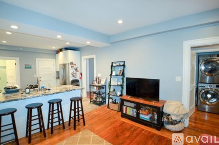 A living room with a bar and a television.