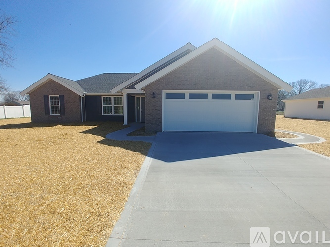 A house with a garage is available for sale.