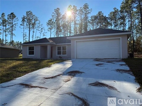 A house with a driveway in front of it is for sale.