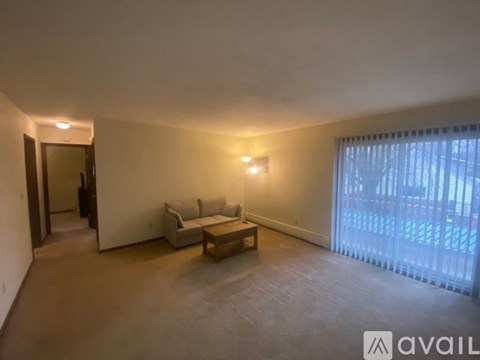 A living room with a couch and a coffee table.