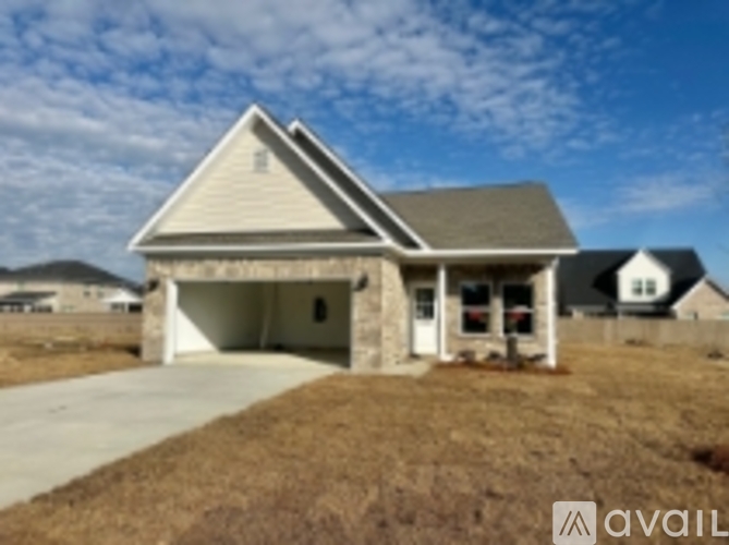 A house with a garage is available for sale.