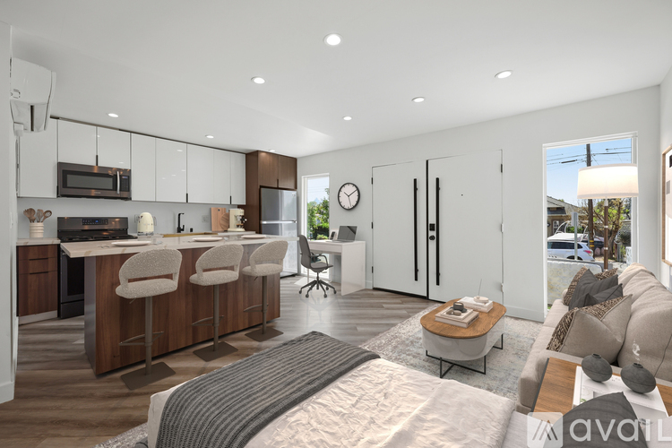 A modern kitchen with wooden cabinets and a large island.