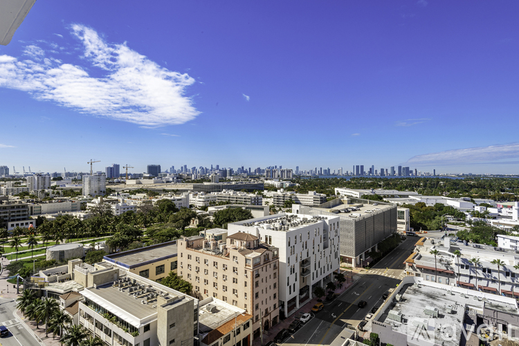 A cityscape with buildings and a clear sky.