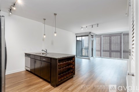 A kitchen with a wine rack and a sink.