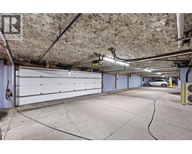 A spacious garage with a car parked inside.