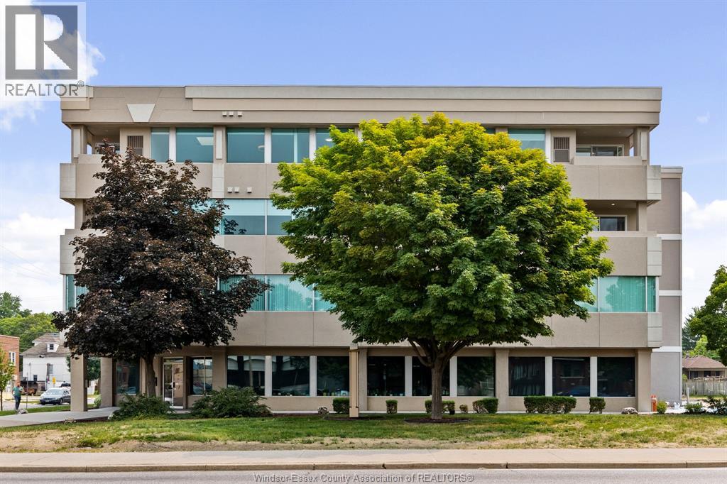 A large building with a tree in front of it.