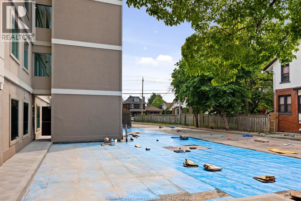 A pool under construction with blue tarp covering the water.