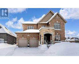 A house with a snow-covered front yard.