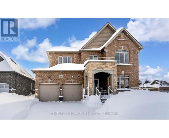 A house with a snow-covered front yard.