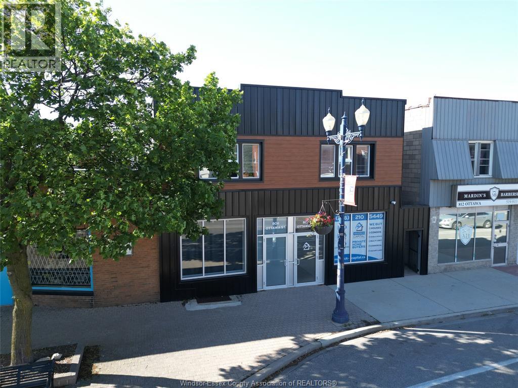 A street view of a building with a sign that reads "REALTORS".