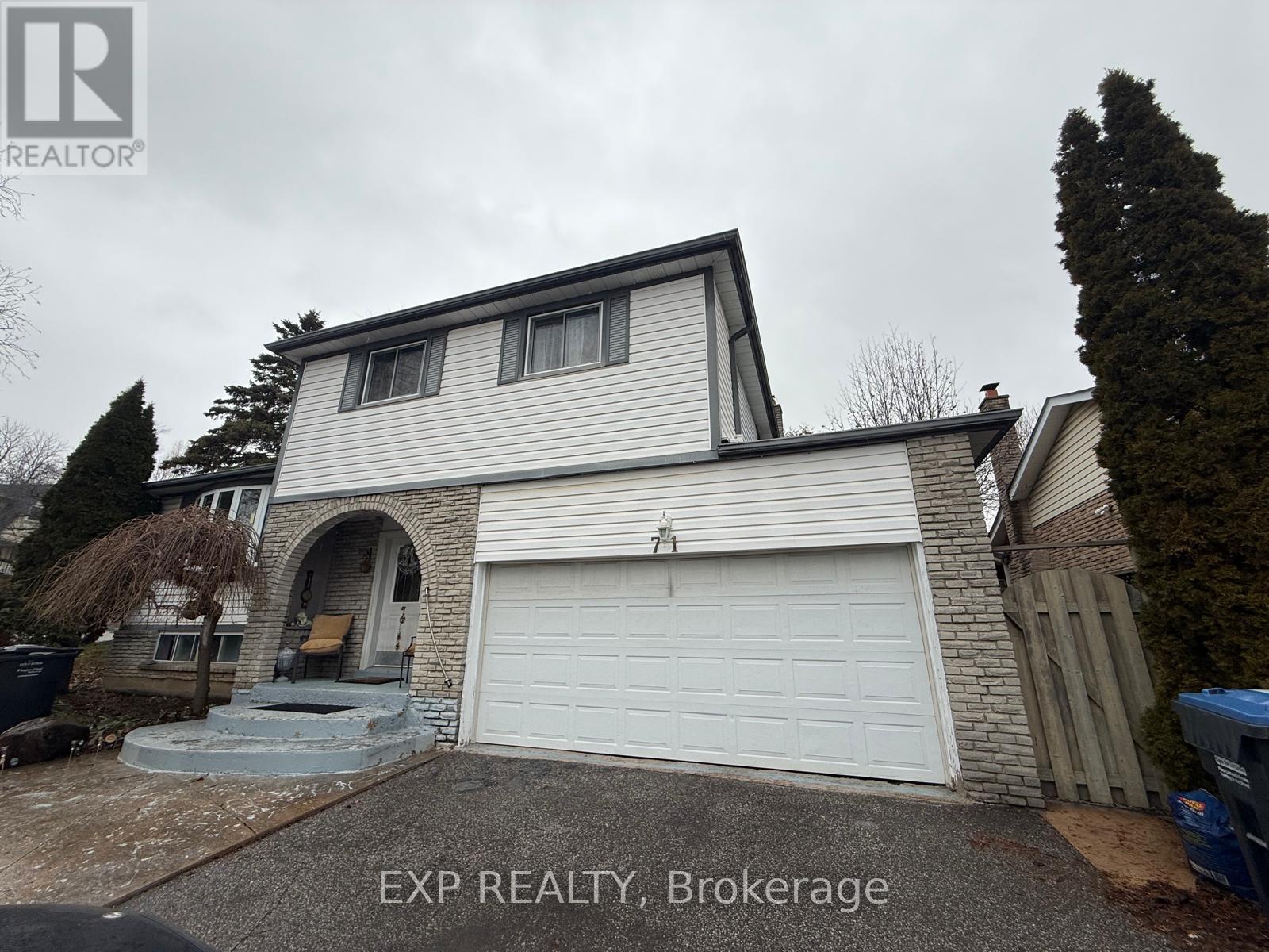 A house with a white garage door is for sale in Brokerage.