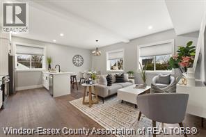 A well-lit, modern living room with a grey sofa and a coffee table.