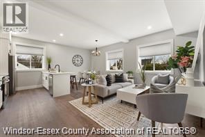 A well-lit, modern living room with a grey sofa and a coffee table.