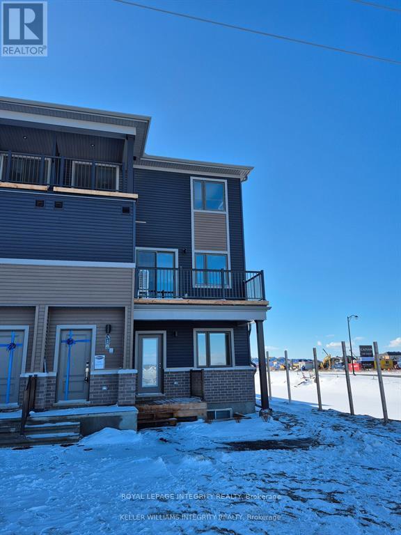 A row of houses with snow on the ground.