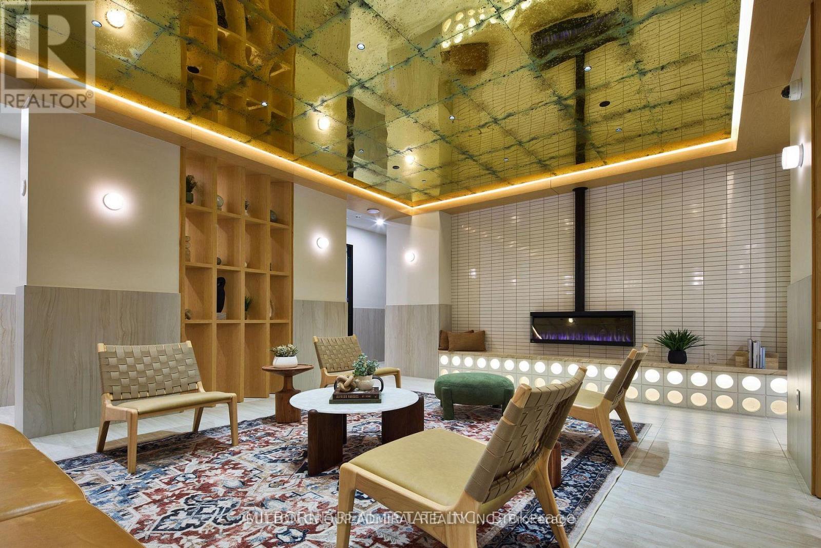 A living room with a glass ceiling and wooden furniture.