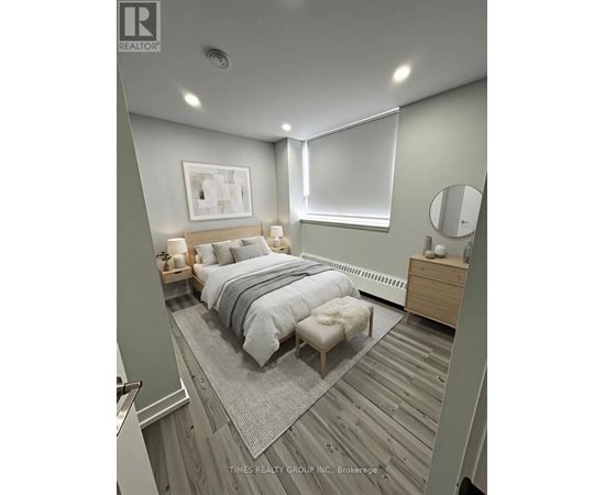 A bedroom with a bed, nightstand, and a mirror.