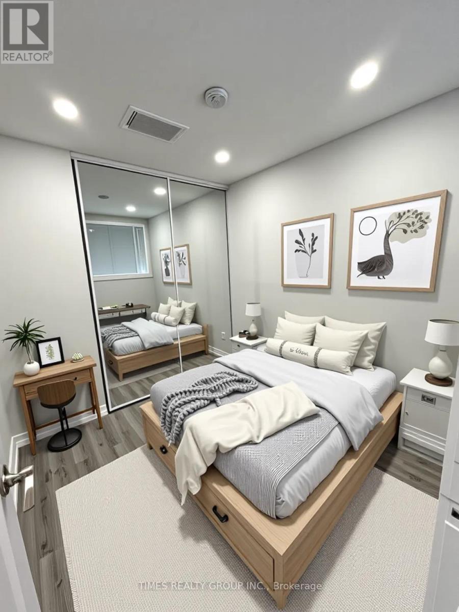A bedroom with a large bed, a mirror, and two nightstands.