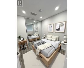 A bedroom with a large bed, a mirror, and two nightstands.