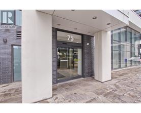 The number 75 is displayed on a glass door.