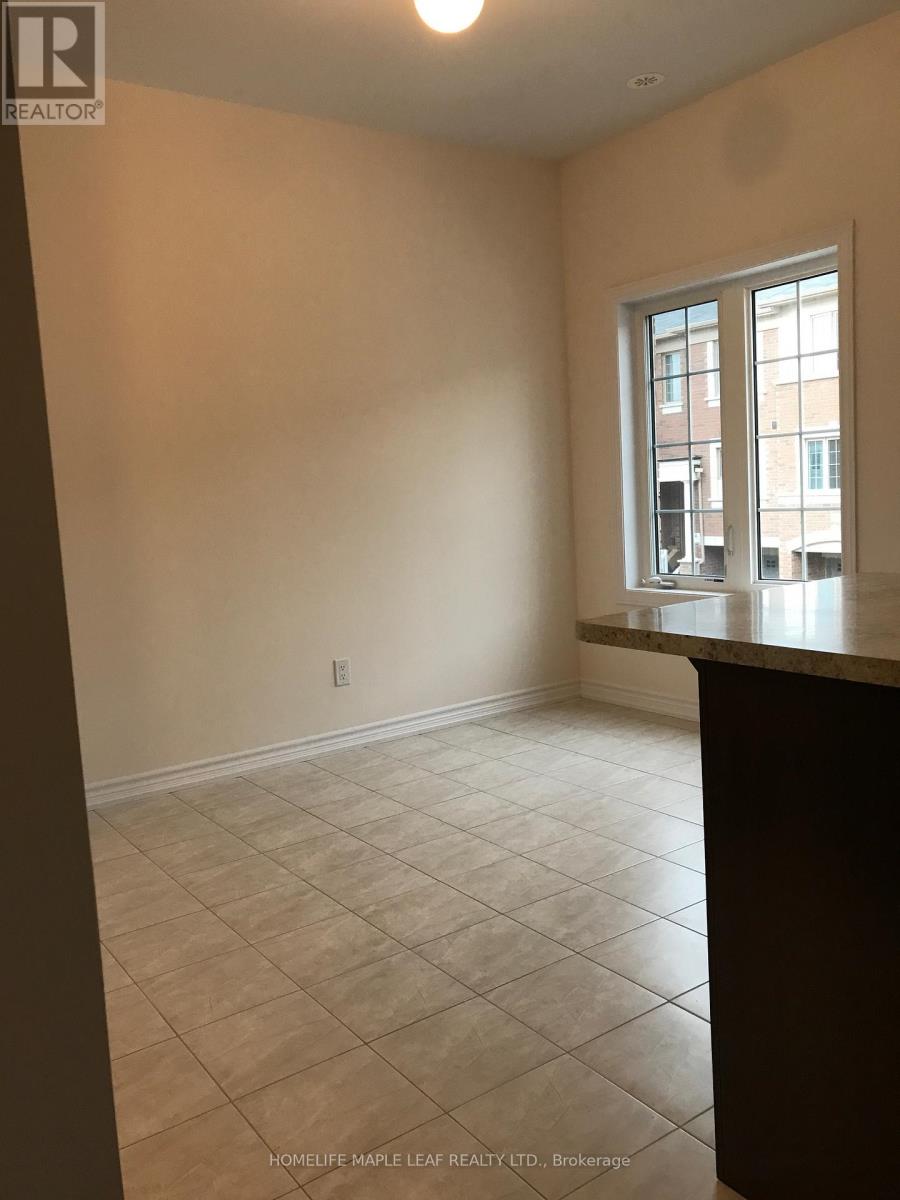 A room with a tiled floor and a window overlooking a street.