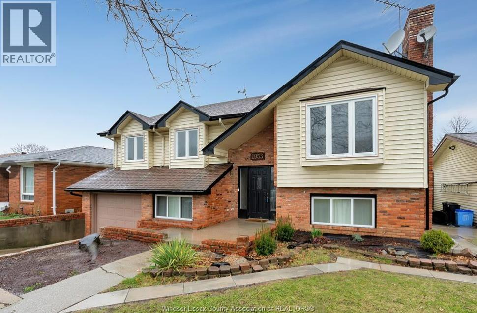 A two-story house with a brick facade and a black front door.
