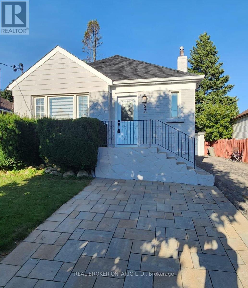 A house with a realtor sign in front.