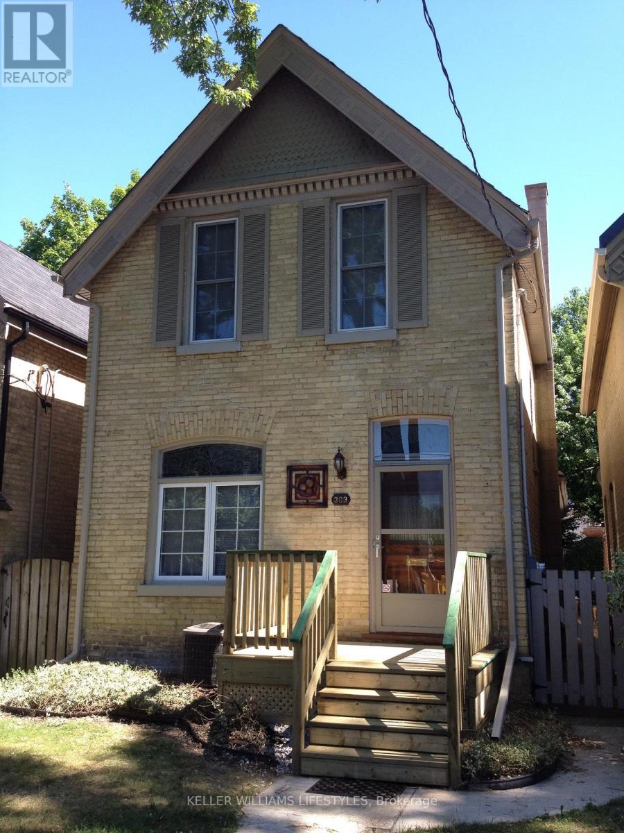 A house with a brown roof and a white door.