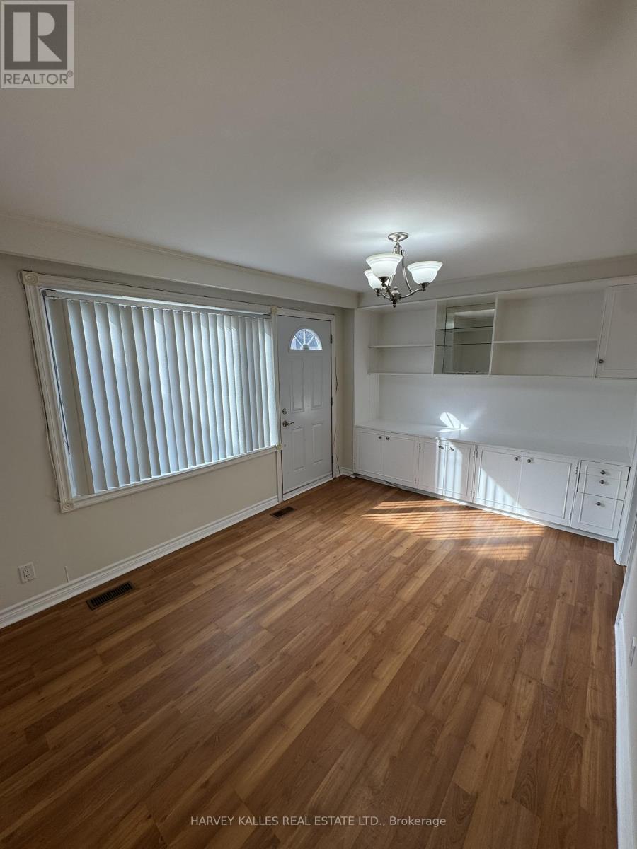 A room with wooden floors and white walls.