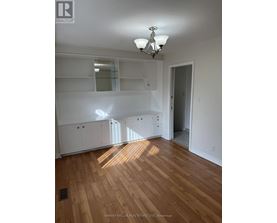 A room with wooden floors and white walls.