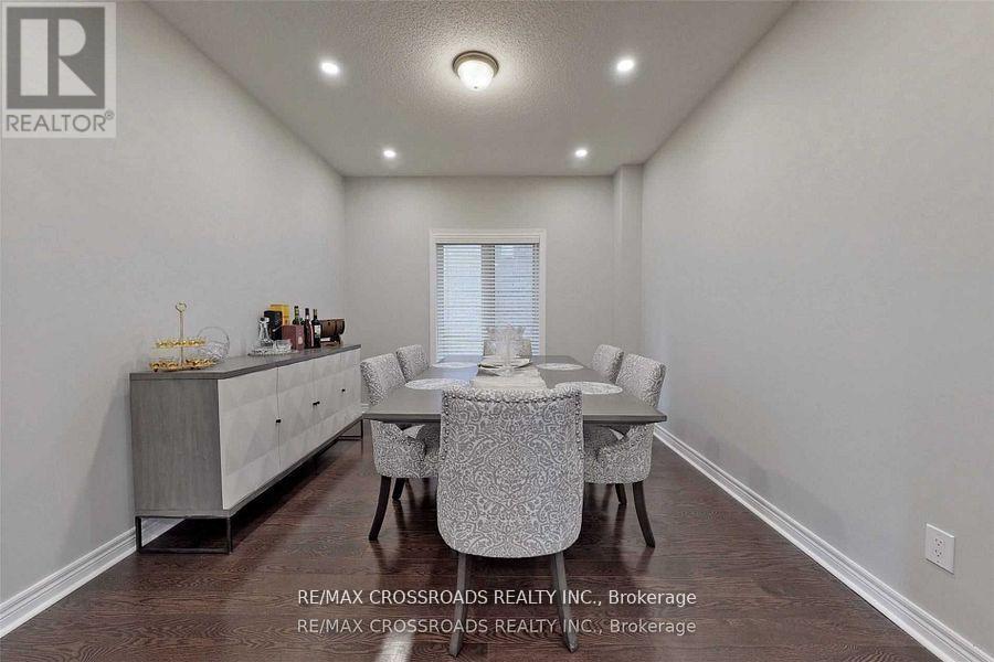 A dining room with a table set for six.
