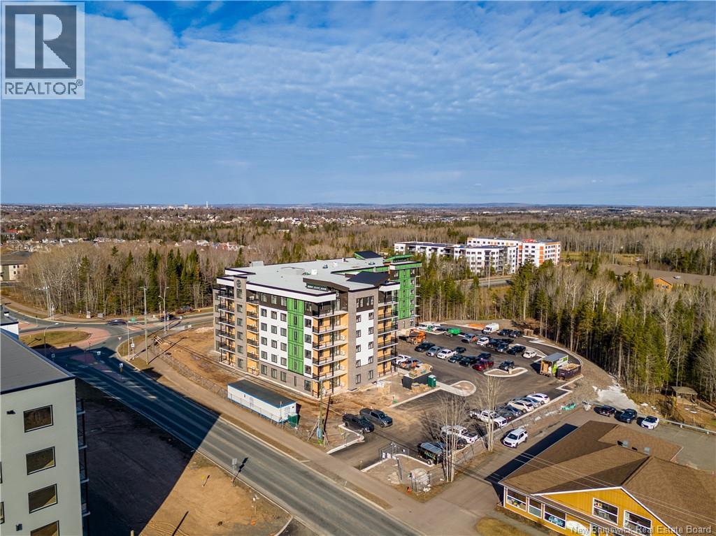 A realtor logo is visible on the top left corner of the image.